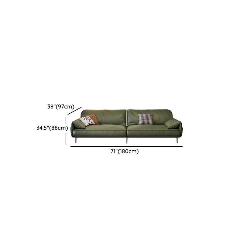 Three decorative pillows on olive green couch