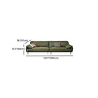 Three decorative pillows on olive green couch