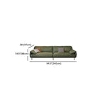 Six-seater olive green couch in cozy setup