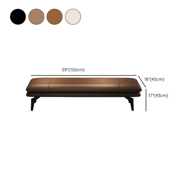 Long upholstered bench chair stylishly placed at the foot of the bed