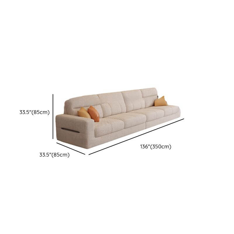 Cozy beige sofa with cushions