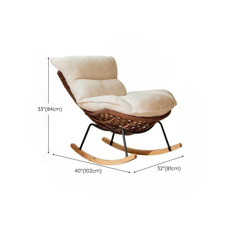 Rattan indoor rocking chair against a window