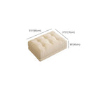Profile view of the cream sofa