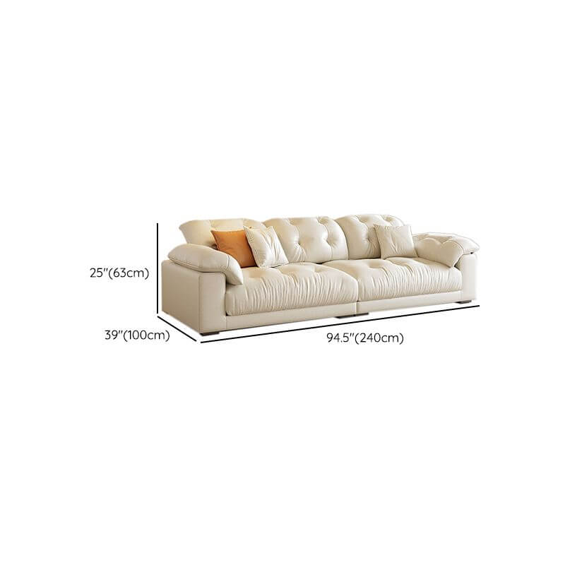 White modern sofa with three decorative pillows