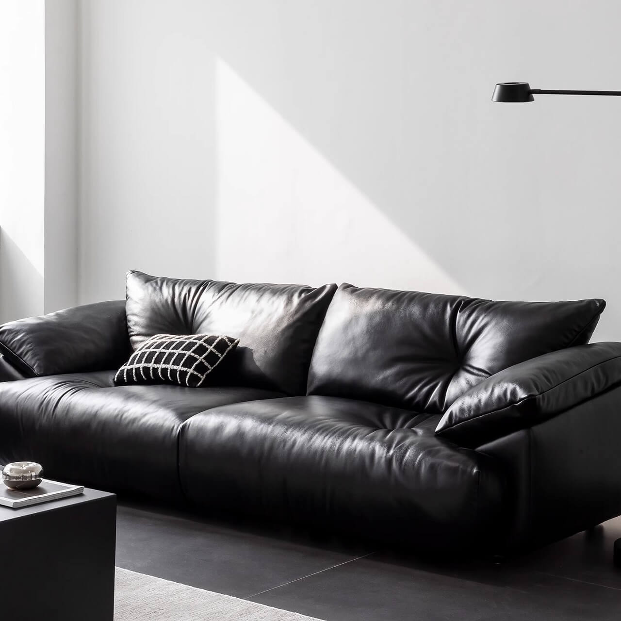 Black microfiber leather sofa with sleek minimalist design for comfort and style
