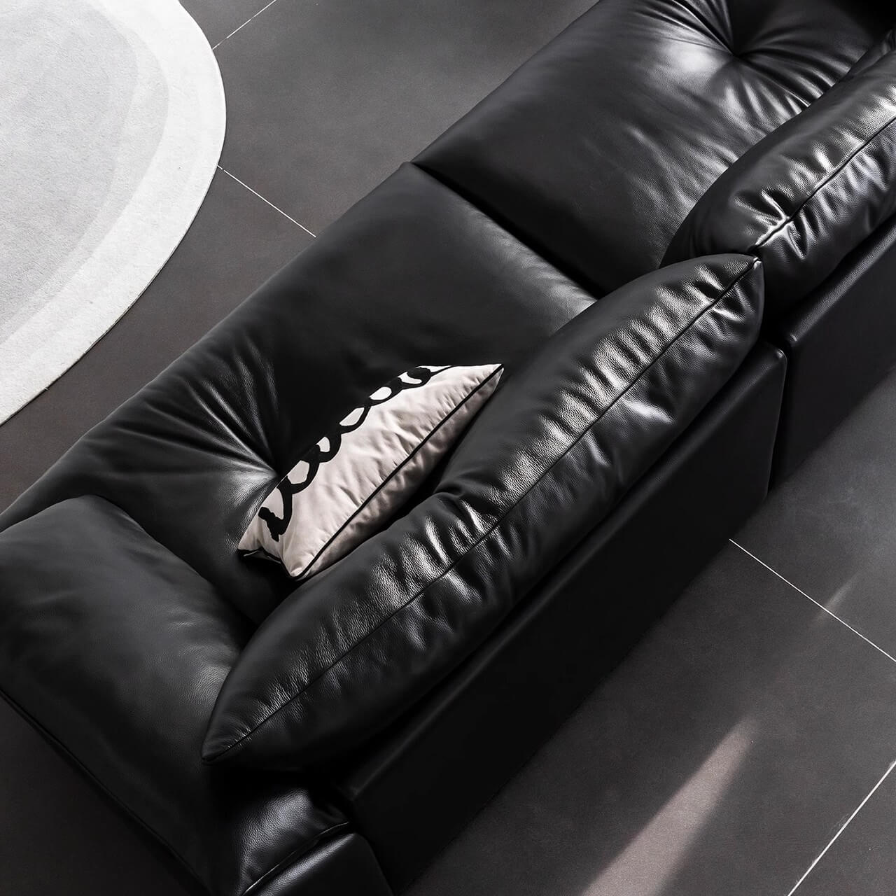Black microfiber leather sofa with sleek minimalist design for comfort and style
