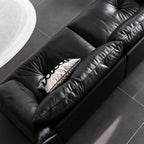 Black microfiber leather sofa with sleek minimalist design for comfort and style
