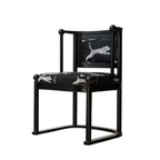 Single vintage dining chair with black fabric and leopard print upholstery