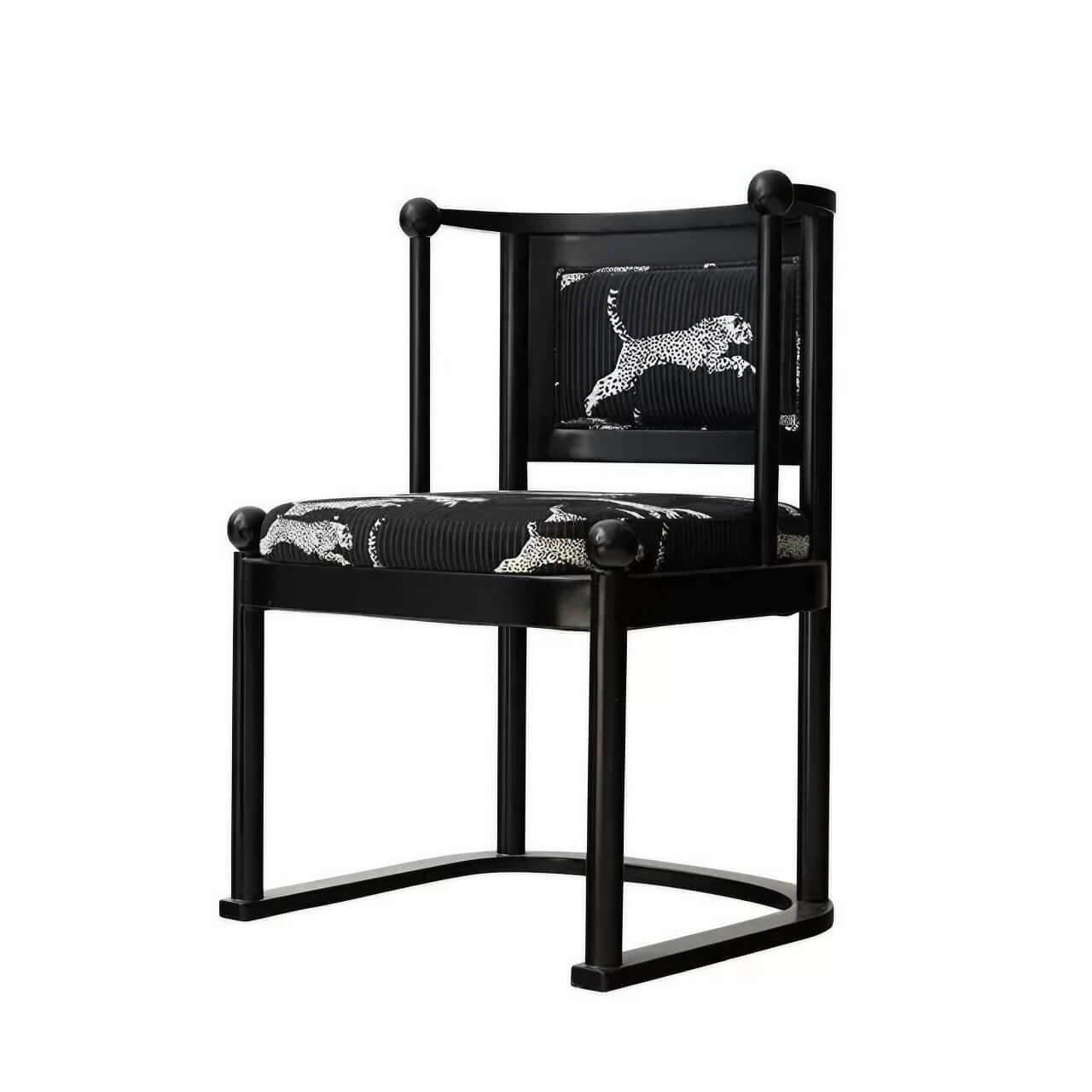 Single vintage dining chair with black fabric and leopard print upholstery