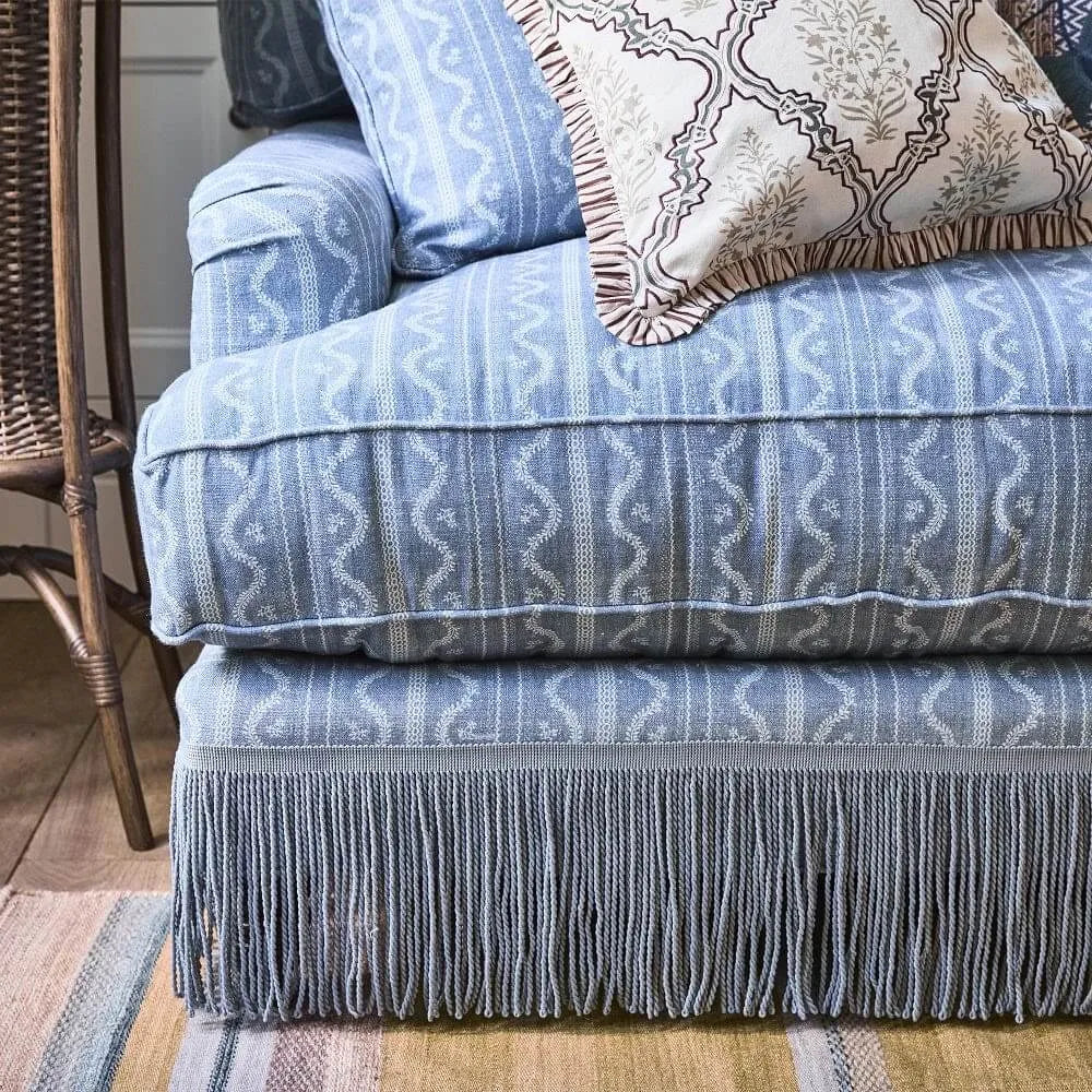 Vintage Patterned Fringe Sofa with Rolled Arms and Plush Cushions