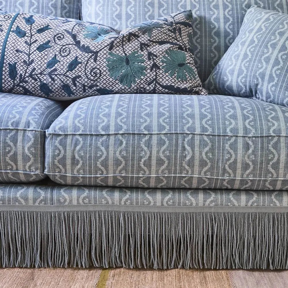 Vintage Patterned Fringe Sofa with Rolled Arms and Plush Cushions