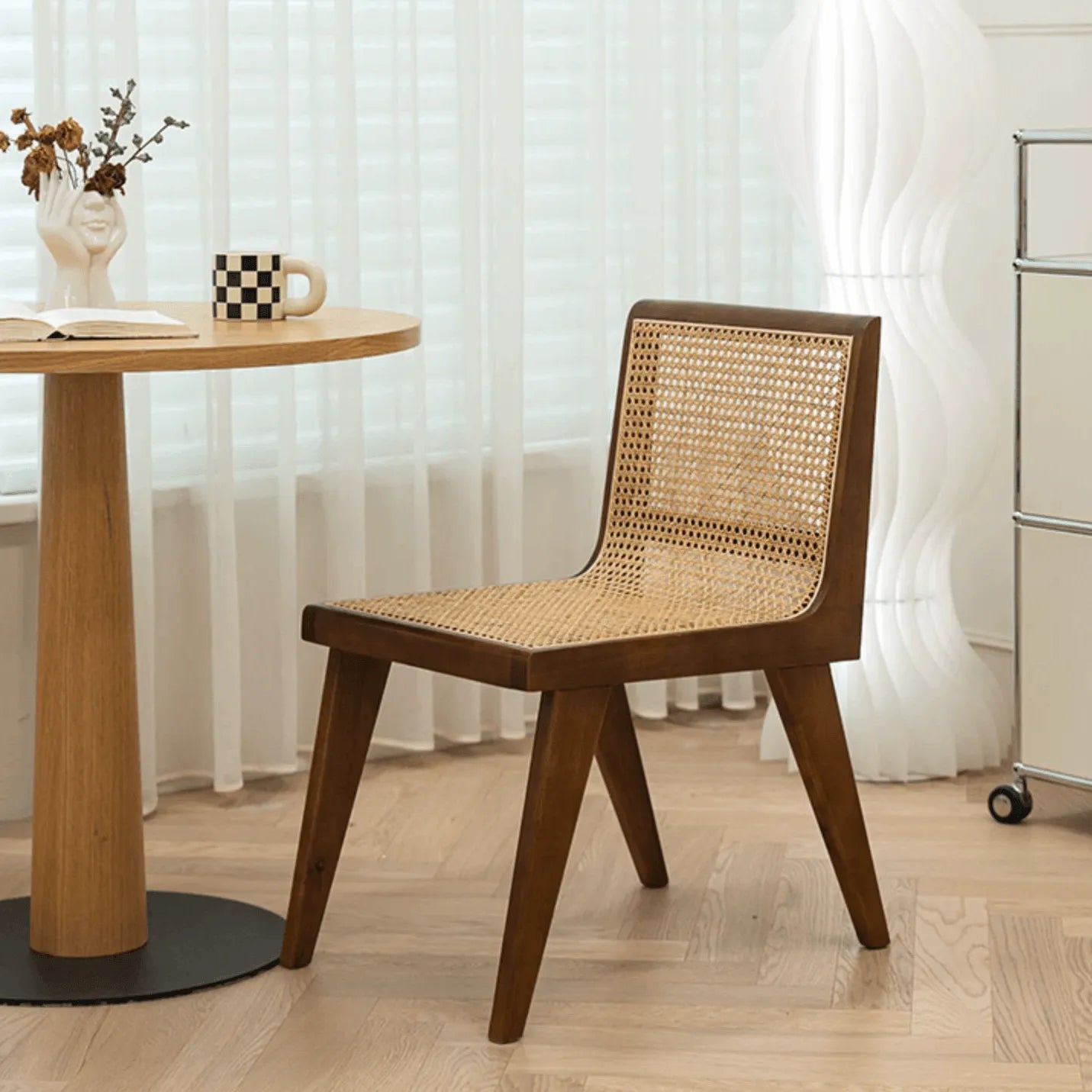 Vintage Rattan Dining Chair with Sculptural A-Frame Legs and Contoured Back Main Product Image