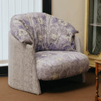 Violet Floral Accent Armchair with Embracing Curves and Retro Lounge Appeal