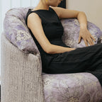 Violet Floral Accent Armchair with Embracing Curves and Retro Lounge Appeal