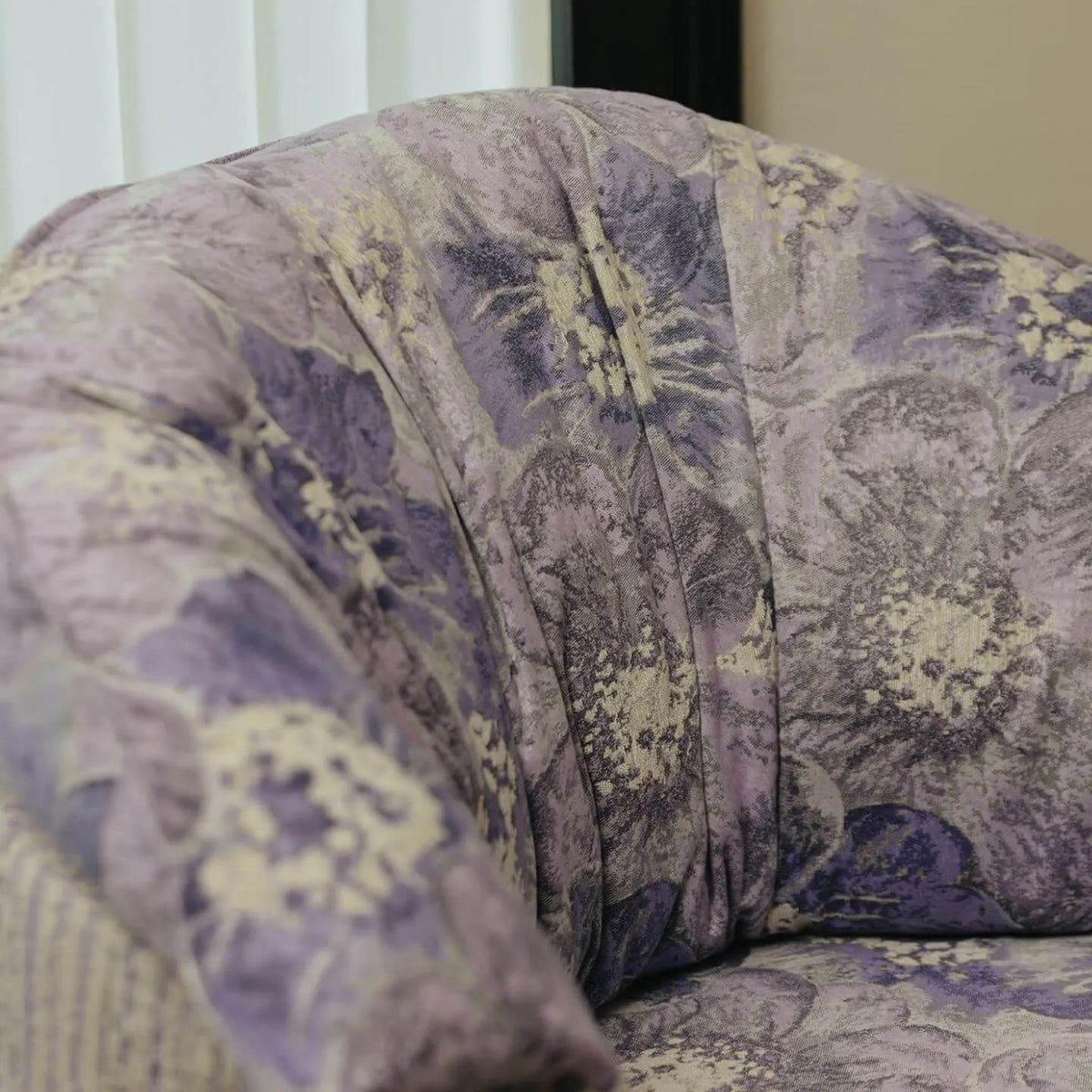 Violet Floral Accent Armchair with Embracing Curves and Retro Lounge Appeal
