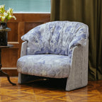 Violet Floral Accent Armchair with Embracing Curves and Retro Lounge Appeal Main Product Image