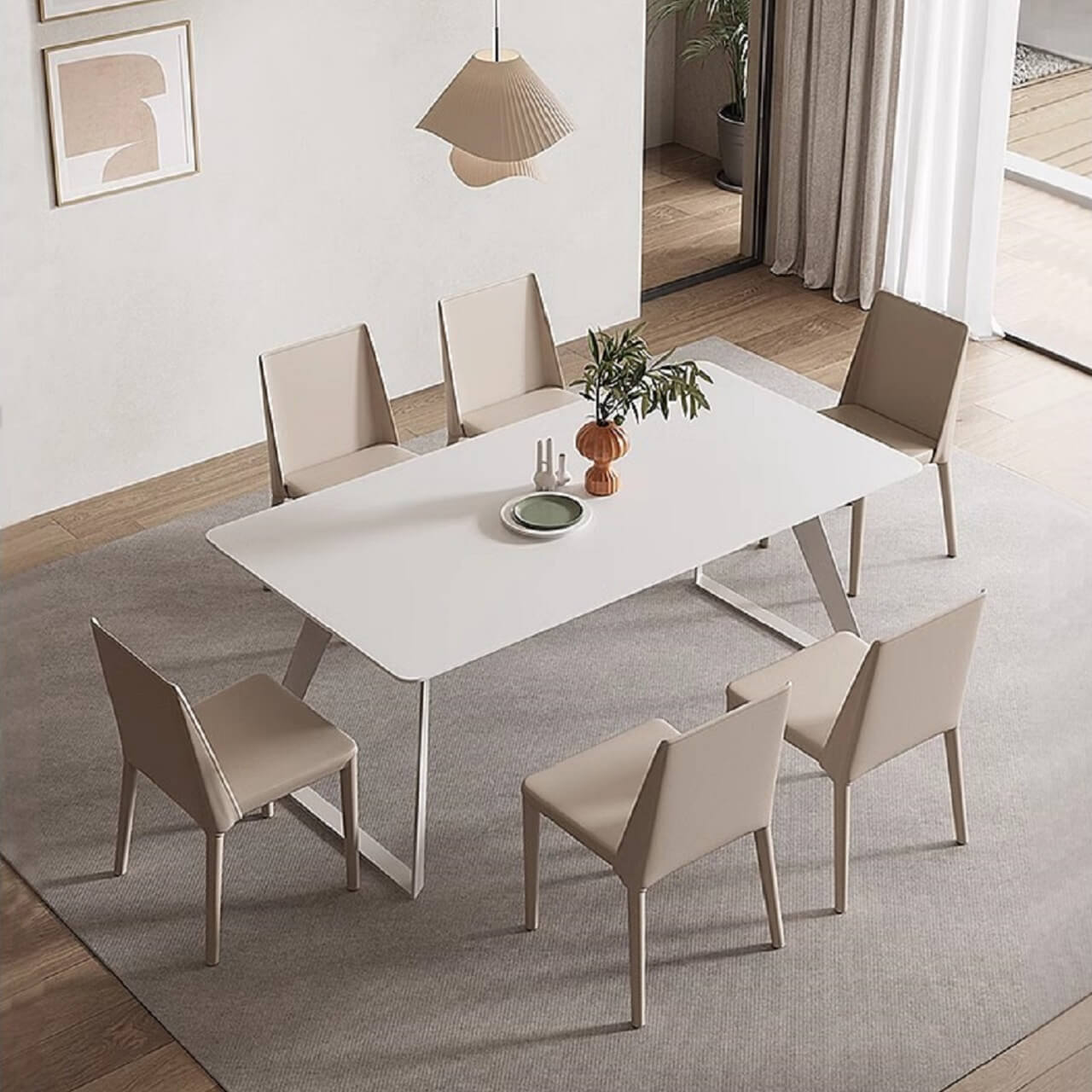 Elegant Italian minimalist dining table with white creamy rock tabletop and carbon steel legs in a modern setting