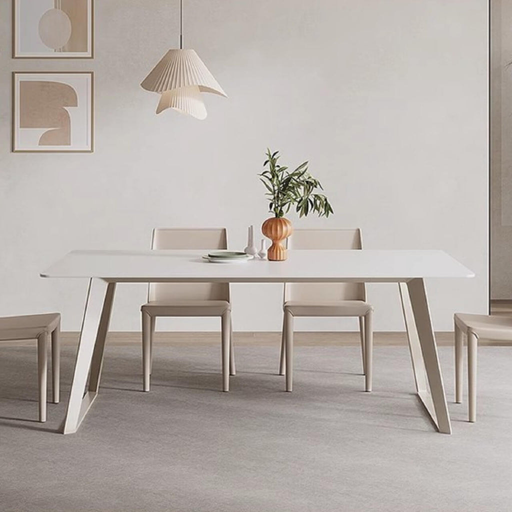 White rectangular dining table with creamy rock tabletop and carbon steel legs, Italian minimalist design