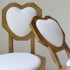 Single white woolen dining chair with heart-shaped back and high aesthetic design