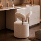 Wingback Ivory Vanity Stool with Hidden Casters and Sculptural Base