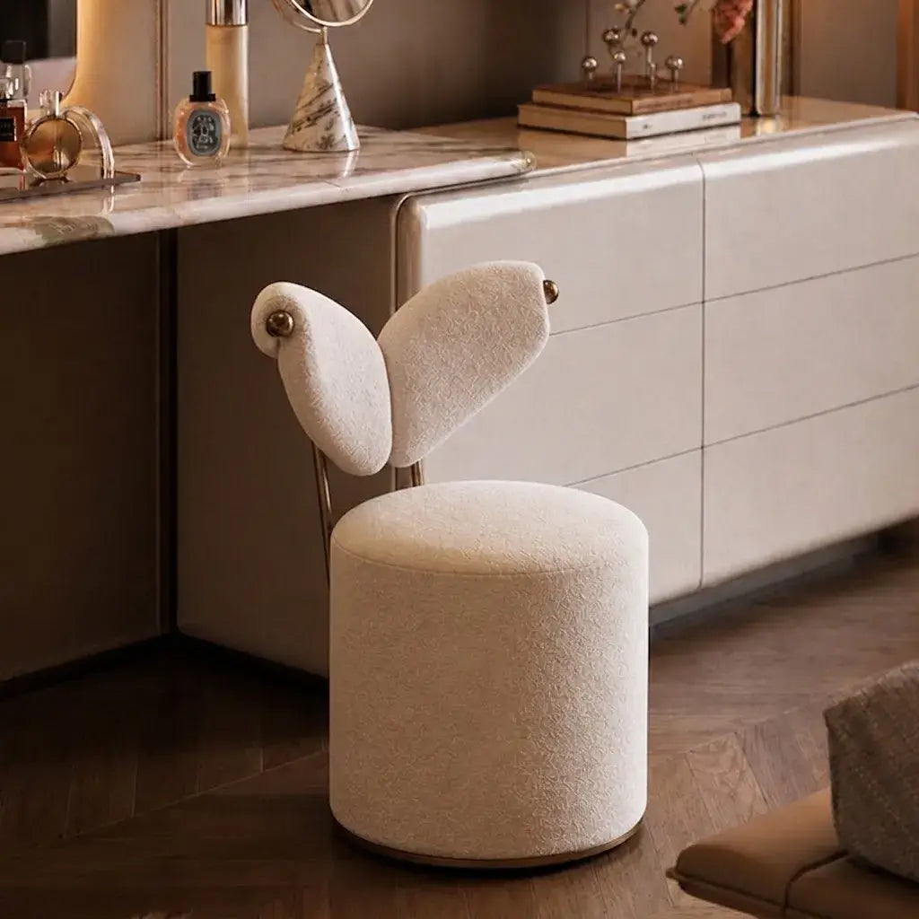 Wingback Ivory Vanity Stool with Hidden Casters and Sculptural Base