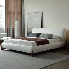 Elegant modern white boucle platform bed with sturdy king size frame and luxurious upholstered headboard