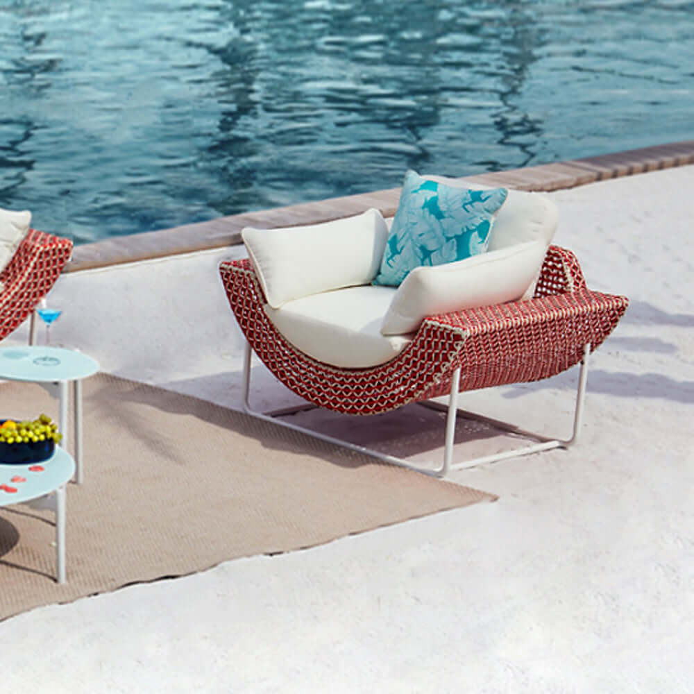 Elegant aluminum and rattan outdoor patio sofa with cushion in white and orange