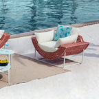 Elegant aluminum and rattan outdoor patio sofa with cushion in white and orange