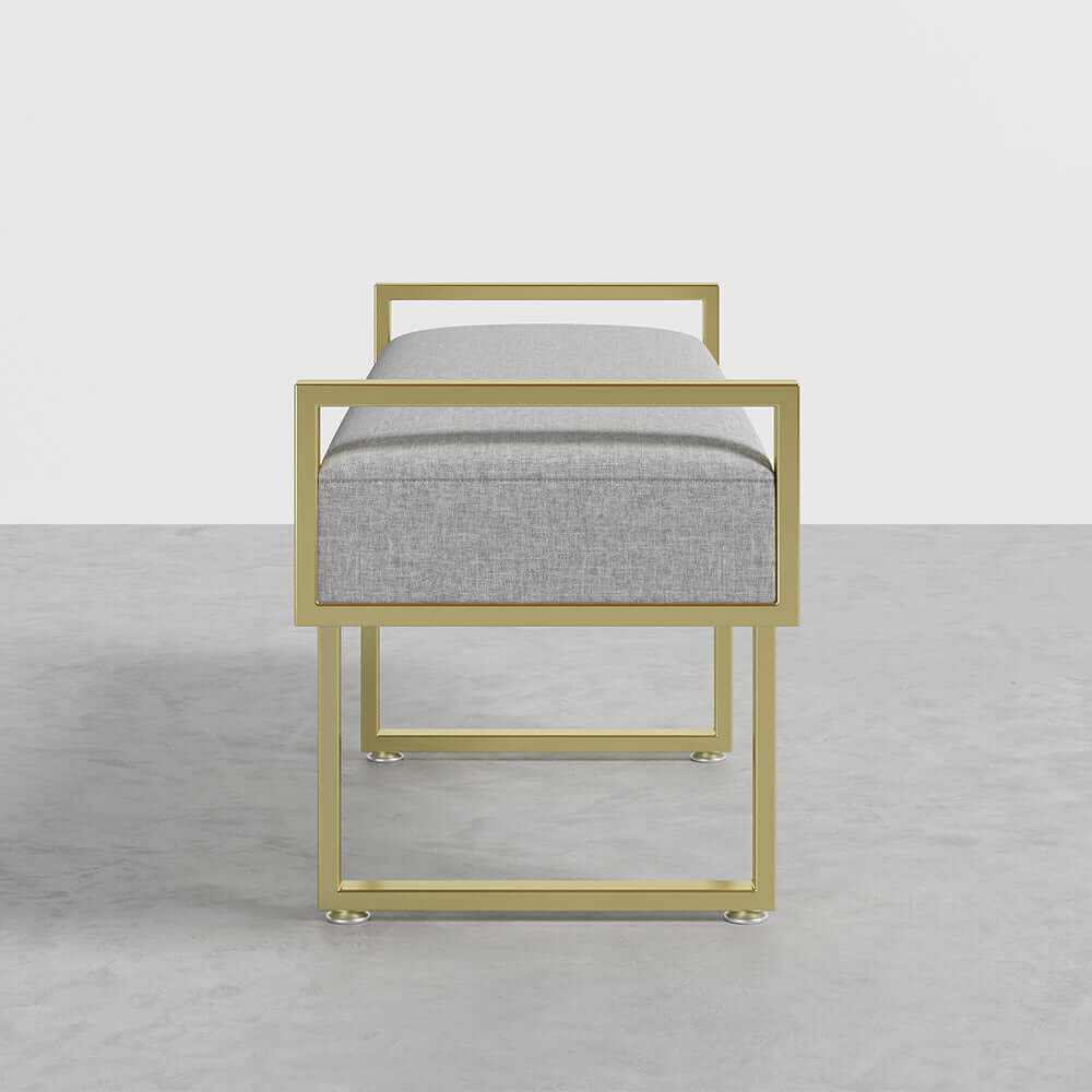 Gray linen upholstered ottoman bench featuring elegant gold legs, perfect for modern bedroom