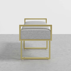 Gray linen upholstered ottoman bench featuring elegant gold legs, perfect for modern bedroom