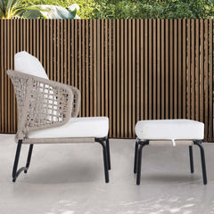 Modern outdoor sofa with ottoman in white and black color scheme