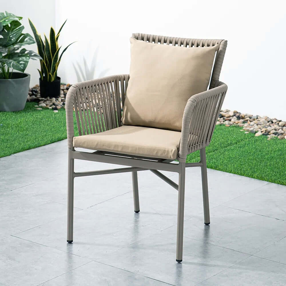 7-piece outdoor dining set featuring wood top trestle table and 6 stylish woven rope armchairs