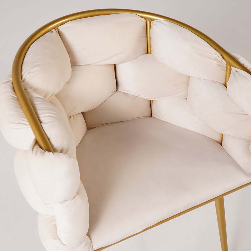 Glamorous beige velvet armchair with sophisticated gold legs for fashionable home decor