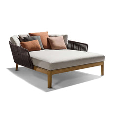 Contemporary rattan daybed for outdoor relaxation with soft cushion pillow