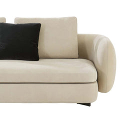 Beige fabric upholstered L-shaped sofa with black metal leg and contemporary style