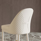 Elegant modern beige dining chair with faux leather upholstery and robust solid wood frame