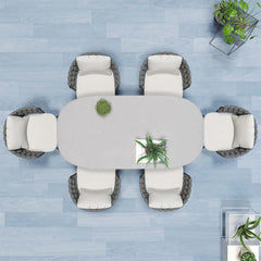 Outdoor dining set including 7 pieces, faux marble top, aluminum table, and rope woven chairs