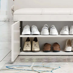 Sleek white entryway bench with organized shoe storage and stylish upholstery