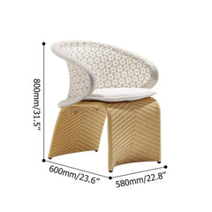 Hofer patio arm chair with white cushion, weather-resistant rattan, arched bottom, and low-back design