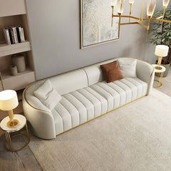 Modern faux leather upholstered three-seater sofa in black with luxurious gold legs