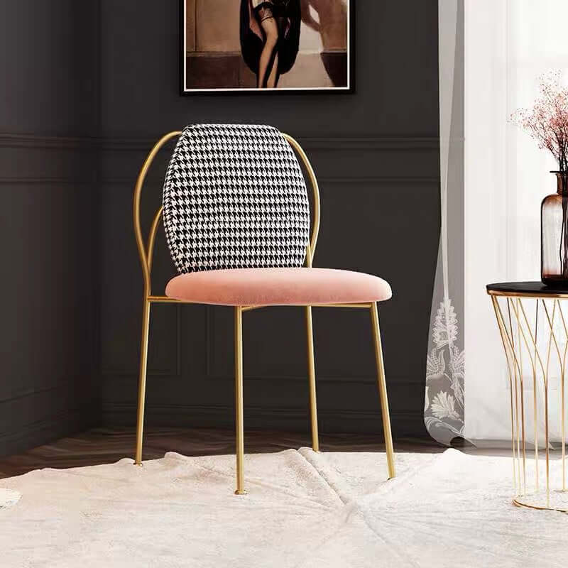 Trendy armless dining chair designed with stunning gold metal legs, exquisite side chair for sophisticated dining area