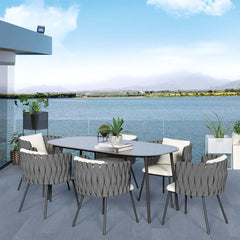 Aluminum outdoor dining set with faux marble top and 7 pieces of rope woven chairs