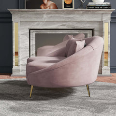 Elegant 63 inch curved sofa in pink velvet with gold metal base and included toss pillow