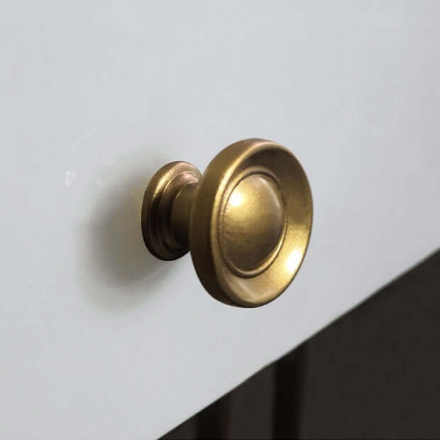 Small gold makeup vanity table with faux marble tabletop, mirror, and drawer