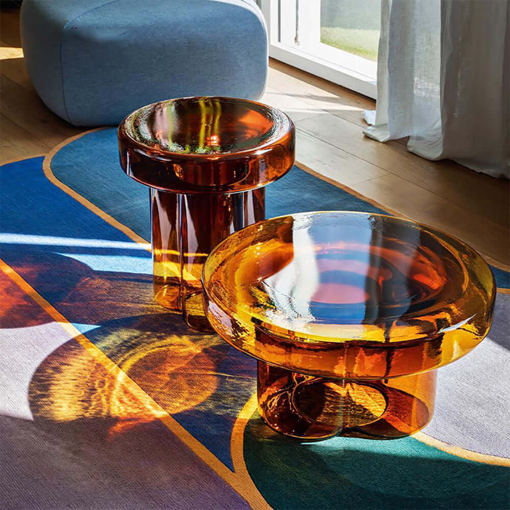 Cloud-shaped modern glass coffee table set with two pieces in vibrant orange, green, purple, and black