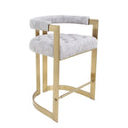 Luxurious velvet upholstered bar stool in elegant gray and gold tones