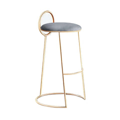 Trendy gray velvet bar stool with low back and glamorous gold legs for stylish home furnishings