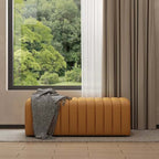 Luxurious upholstered orange leather bench with tufted details for stylish entryway