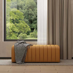 Luxurious upholstered orange leather bench with tufted details for stylish entryway