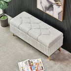 Modern gray velvet storage bench with gold legs for elegant decor